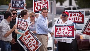 Republican Senate candidate Ted Cruz greets supporters outside a polling station in Houston, Tuesday, July 31, 2012.