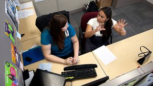 Rachel Bristow, a caseworker for Goodwill's GED program, assists 22-year-old Anita Rodriguez, who received her GED in August 2011, with her financial aid application at the Goodwill Resource Center in Austin, Texas.