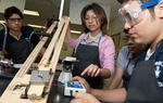Students in the Hidalgo Independent School District physics classroom work on a project on acceleration with a sloped ramp in a regular science class at Hidalgo Early College High School.