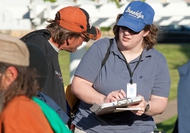 U.S. Census workers count the transient population gathered at Wooldridge Park in downtown Austin Tuesday night during a regularly scheduled dinner delivery to the homeless by the group Mobile Loaves and Fishes.  Some participated in the questioning but others declined to be interviewed.    