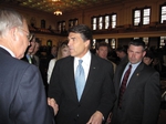 Perry shakes hands after a speech in the Texas House.