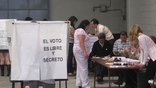 Voters line up to cast ballots in Mexico's presidential election Sunday at a voting sight on Popocatepetl street in Mexico City's Colonia Condesa.
