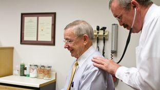 Capitol nurse practitioner Tim Flynn performs a routine check-up on state Rep. Warren Chisum on April 11, 2012.