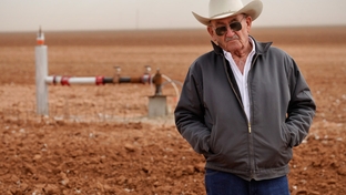 Tommy Fondren in his cotton field near a well pumping station in Lorenzo, TX, on Mar. 8, 2012