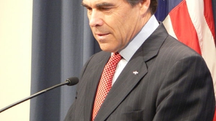 Governor Rick Perry at the podium in his press conference room