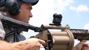 Gov. Perry fires an M-32 grenade launcher.