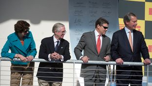 Awards stand of the Formula One Grand Prix in Austin, left to right, Comptroller Susan Combs, Nick Craw of FIA, Governor Rick Perry and Lt. Governor David Dewhurst.