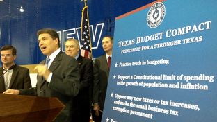 Gov. Rick Perry unveils his "Texas Budget Compact" in Houston on Monday, April 16. On stage with Perry, from left to right: state Reps. Brandon Creighton, R-Conroe, and Wayne Smith, R-Baytown, and conservative activist Michael Quinn Sullivan.