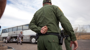 Border Patrol officers outside a bus in Presidio.