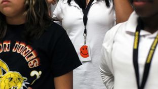 North Side Independent School District in San Antonio has implemented a pilot program to track students while on campus, having them wear radio frequency identification (RFID) chips on cards around their neck which are scanned by hidden cameras in the ceilings as well as used for lunch and library. Many students personalize their tags as in a music class at Jones Middle School in San Antonio, September 14, 2012.