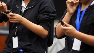 Northside Independent School District in San Antonio has implemented a pilot program to track students while on campus, having them wear radio frequency identification chips on cards around their neck, September 14, 2012.