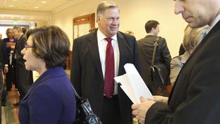 Tom Suehs waiting outside Senate committee hearing on January 31, 2011.