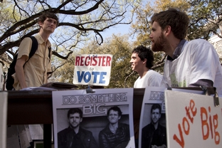 John Lawler, a candidate for student body president at the University of Texas, talks with a student on the West Mall.