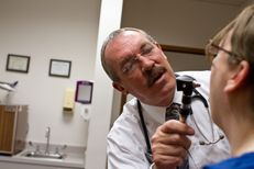 Capitol nurse practitioner Tim Flynn examines a walk-in patient. The Capitol Health Services office is open to anyone on the grounds for walk-in visits.