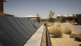A solar field provides power for a water heating system and xeriscaping on a Fort Bliss Army installation.