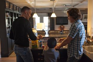 Brian Stephens, left, and Andy Miller with their son, Clark, on Jan. 21, 2013, in Austin.