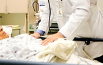 Dr. Carlos Cardenas, chairman of the board at Doctor’s Hospital at Renaissance in Edinburg, talks to a patient before performing an esophagogastroduodenoscopy (EGD) and a colonoscopy exam on Wednesday December 8, 2010. 