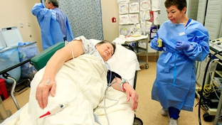 Endoscopy tech Dora Facturan, right, prepares Maria Perez, 65, for a colonoscopy exam from Dr. Carlos Cardenas, back left, on December 8, 2010 at the Doctor's Hospital at Renaissance in Edinburg. South Texans lead some of the longest lives in the state. 