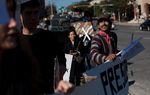 Protesters met in front of the Mexican consulate in Austin on Thursday to draw attention to violence and human rights violations in Mexico. The gathering marked the beginning of a new group keeping an eye on Mexico's new political regime.