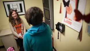 Nicole Griffis, nurse practitioner, consults with a patient at a Planned Parenthood clinic in Austin, Texas.