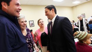 State Representative Trey Martinez-Fischer, right, and District 7 Councilman Justin Rodriguez, left, greet Rodriguez's grandmother, Inez Randon Ramirez, and her friend, Mary Barker as they get out the message to vote at the Alicia Trevino Lopez Senior Center in San Antonio, Friday, October 26, 2012.