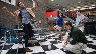 At Houston's High School for the Performing and Visual Arts, Keenan Hurley (left), 18, and Roby Attal, 17, react to missing their target during a physics lesson on projectile motion that used Hot Wheels cars.