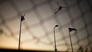A U.S. Border Patrol helicopter patrols over the Paso del Norte International Bridge between El Paso, Texas and Ciudad Juárez, Mexico on Tuesday March 27, 2012.