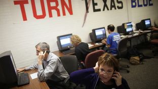 Travis County Democratic Party volunteers make calls to voters on Election Day from the coordinated campaign headquarters in Austin, Texas.