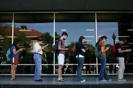 Voters wait in line to cast their ballots at the Flawn Academic Center on the University of Texas at Austin campus on Tuesday, Nov. 6, 2012 in Austin, Texas.