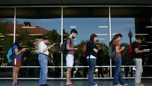 Voters wait in line to cast their ballots at the Flawn Academic Center on the University of Texas at Austin campus on Tuesday, Nov. 6, 2012 in Austin, Texas.