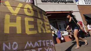 Voters wait in line to cast their ballots at a location across the street from the University of Texas at Austin campus on Tuesday, Nov. 6, 2012 in Austin, Texas.
