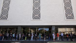 Voters wait in line to cast their ballots at the Flawn Academic Center on the University of Texas at Austin campus on Tuesday, Nov. 6, 2012 in Austin, Texas.