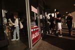 Voters wait in line to cast their ballots at a polling station in the Hancock Center on Tuesday Nov. 6, 2012 in Austin, Texas.