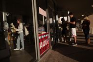Voters wait in line to cast their ballots at a polling station in the Hancock Center on Tuesday Nov. 6, 2012 in Austin, Texas.