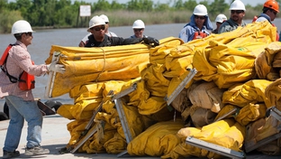 Contracted workers from U.S. Environmental Services organize boom for deployment at the Venice, La., staging area Thursday, April 29, 2010. Staging areas have been placed in areas so quick deployment of assets and personnel could be utilized to protect environmentally sensitive areas. 