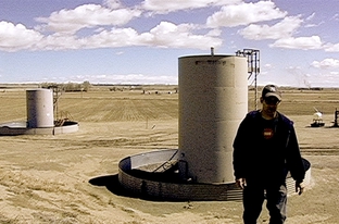 Josh Fox, creator of "Gasland," stands in a Wyoming gas field.