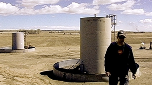 Josh Fox, creator of "Gasland," stands in a Wyoming gas field.