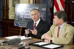 Attorney General Greg Abbott, left, and Gov. Rick Perry