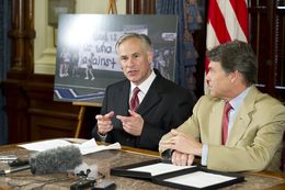 Attorney General Greg Abbott, left, and Gov. Rick Perry