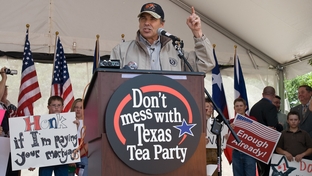 Texas Gov. Rick Perry addresses a crowd estimated at 1,000 at a tax day "tea party" April 15 at City Hall to protest federal government stimulus programs