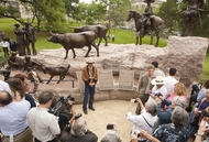 Tejano monument artist Armando Hinojosa in front of the sculpture after its unveiling ceremony on the grounds of the Texas Capitol on March 29, 2012.