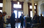 Capitol visitors pass through metal detectors.