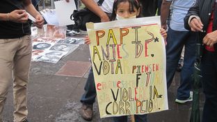 A young Mexican child at a YoSoy132 protest in Mexico City's Plaza de Las Tres Culturas. The sign pleads for voters to think of the child's generation when casting their ballots.