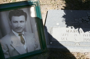 A photograph of Marcos Guerra at the gravesite in San Benito, Texas.