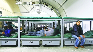 Detainees and bunk beds inside the Willacy Immigration Detention Center. 