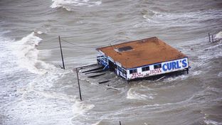 Joint Task Force-129 crew, Jolly 92, flies over the storm surge that overtook the Bolivar Peninsula bridge near Galveston, Texas, Sept. 12, 2008.