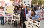 Democrat Bill White held a news conference Monday in front of the Texas Ethics Commission, calling for limits on the size of contributions to gubernatorial candidates.