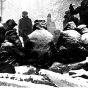 Internees huddled around fire