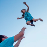 Child Being Thrown in the Air