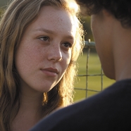 Blonde girl looking at boy in the movie Modra